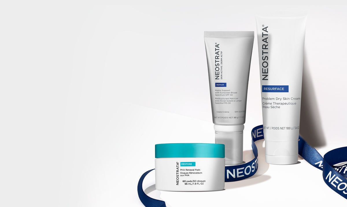 Three Neostrata products wrapped in a blue ribbon against a white background.