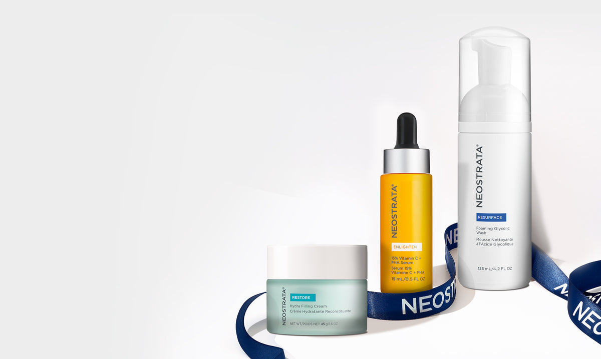 Three Neostrata products wrapped in a blue ribbon against a white background.